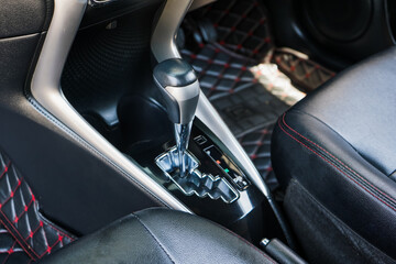 automatic transmission shift selector in the car interior. Closeup a manual shift of modern car gear shifter. 4x4 gear shift	
