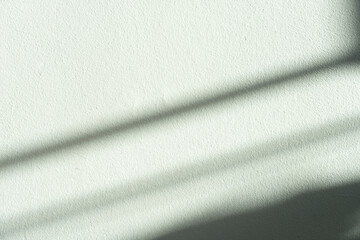 Obraz premium Green wall Cement rough texture background,Backdrop Room Display with Shadow Striped diagonal sunlight reflection,Empty Studio background with sunshine effect overlay on concrete floor.
