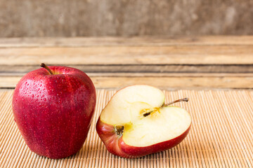 fresh red apple on wooden table
