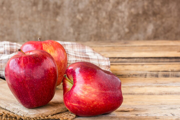 fresh red apple on wooden table