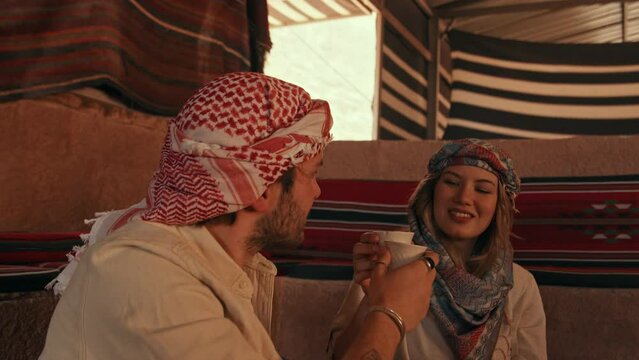 Two Tourists Drinking Bedouin Coffee