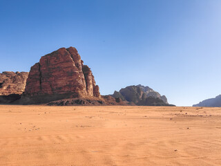 Fototapeta na wymiar Amazing and spectacular landscapes of Wadi Rum desert in Jordan. Dunes, rocks and red Sand