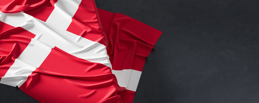 Flag of Denmark. Fabric textured Denmark flag isolated on dark background. 3D illustration