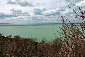 Landscape with lake and blue sky with clouds.