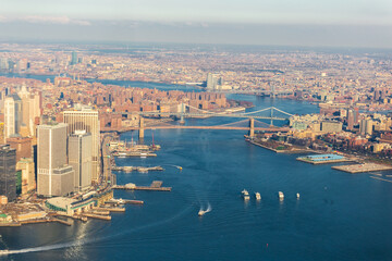 New York City skyline and Hudson River as seen from Helicopter at sunset, One World Trade Center view. Aerial view of Manhattan, Battery Park, freedom tower, Downtown, Finance center - obrazy, fototapety, plakaty