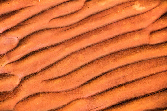 Rippled textured red rock that naturally occurs in Central Australia from when there was an inland s
