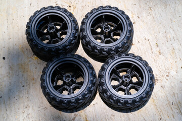 A set of toy car tires. Four pieces of RC (Remote Control) Car tires. Toys Photography. Hobbies and leisure. Selective Focus. Textured Details. Shot in Macro lens