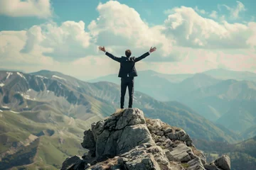 Foto op Plexiglas Businessman in a suit on top of a mountain celebrating his victory and success, conquers a challenging mountain peak, symbolizing determination, ambition © Ilia