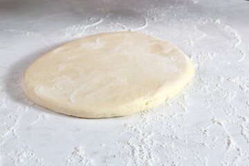 Sheet of dough on floured table. Making Treacle Pie Series.