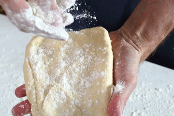 Chef sprinkle dough with flour. Making Treacle Pie Series.