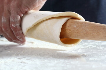 Fold dough over rolling pin. Making Treacle Pie Series.