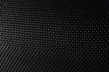 Textured matt black speaker with sound holes