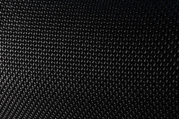 Textured matt black speaker with sound holes