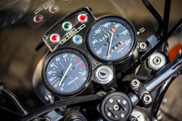 The dashboard of an old motorcycle, close-up. Art lens. Swirl bokeh.