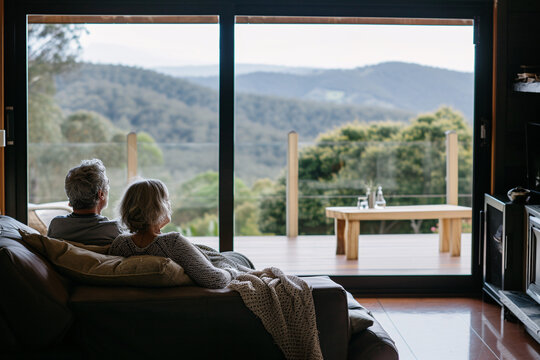 Retired couple enjoying the view in a rural house on vacation. International Day Of Older Persons