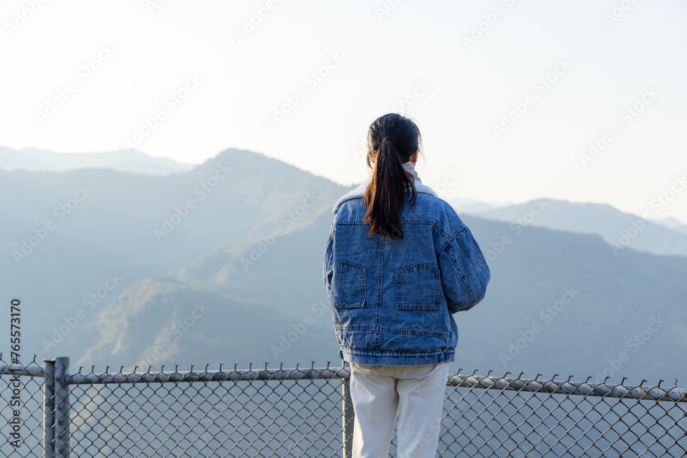 Sticker woman stand at the top mountain in countryside