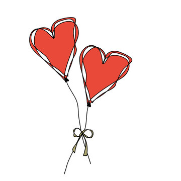 two red heart balloons as a symbol of love and belong together