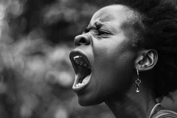 Fotobehang black woman is yelling with a fully open mouth © Igor