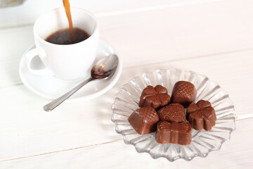 Chocolate Pralines and Pouring Coffee into Cup