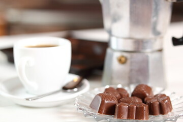 Coffee Cup and Chocolate Pralines