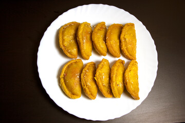 Gujiya or gujia is a popular Indian sweet or pastries with nuts stuffing  prepared during Holi featival.