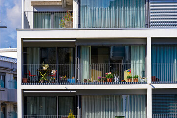 Close-up of balconies of modern apartment building at Swiss City of Zürich on a sunny spring...