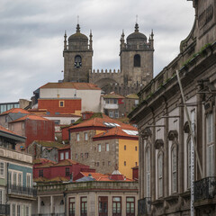 Porto cathedral, seem from below, through a typical Porto street