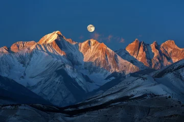 Selbstklebende Fototapeten A full moon is seen rising above a silhouetted mountain range © pham
