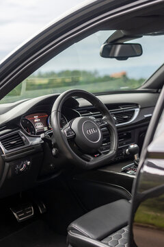 Audi RS6 Avant steering wheel focused shot, full dashboard view, black leather interior - High Resolution Image
