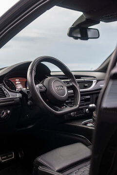 Audi RS6 Avant steering wheel focused shot, full dashboard view, black leather interior - High Resolution Image