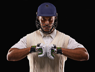 Man, portrait and cricket player with sports gloves in studio for professional competition, training or exercise. Male person, face and protection on black background, pitch gear or mockup space © Duncan M/peopleimages.com