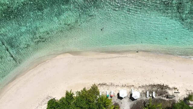 The aerial view of white sand beach tropical with seashore as the island in a coral reef ,blue and turquoise sea Amazing nature landscape with blue lagoon	