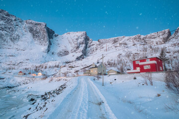  Winter wonderland of traditional fishing village and snow covered mountain on winter at Lofoten Islands