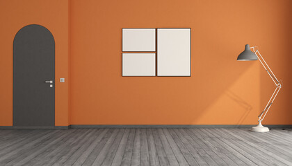 Empty room with orange walls and arched frameless door - 765617721