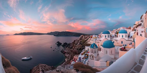 Zelfklevend Fotobehang Beautiful sunset view of Santorini, Greece with white buildings and blue domes overlooking the sea © Kien
