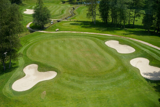 Luxurious beautiful golf course with well prepared green, fairway and bunkers, aerial panoramic view, Chamonix, France