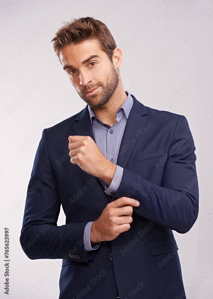 Poster Portrait, studio and businessman with smile, confidence and corporate fashion with pride. Salesman, consultant or entrepreneur man in business suit with stylish gentleman clothes on white background