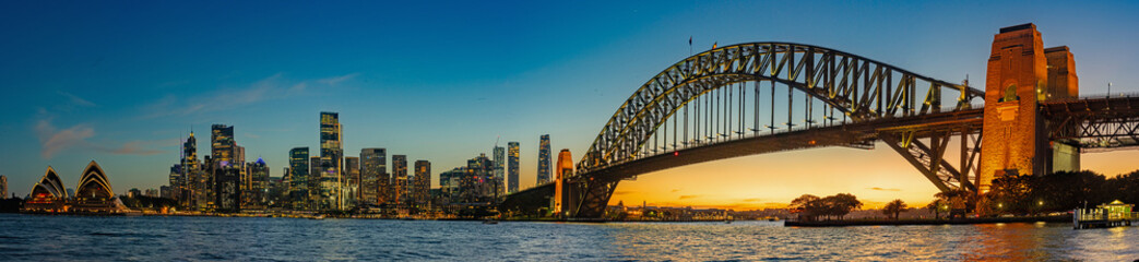 Sydney, New South Wales, Australia; February 25, 2024 - Skyline of Sydney at sunset - obrazy, fototapety, plakaty