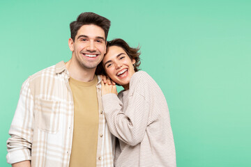 Portrait of smiling, beautiful people, young man and woman, friends embracing, looking at the camera