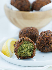 Falafel on white plate with lemon