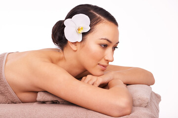 Obraz na płótnie Canvas Spa, wellness and white background of woman for massage, relax or luxury treatment for stress relief. Natural, skincare and female person with flower for zen, self care and detox in studio backdrop