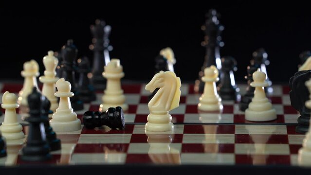 Destruction of chess figures series. Slow motion exploding figures and pawns. Symbolic illustration of total war, disagreement, disaster and failure.