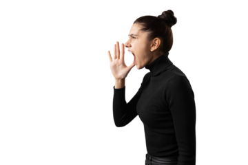 A young woman in black clothing shouting, isolated on a white background, expressing strong emotion