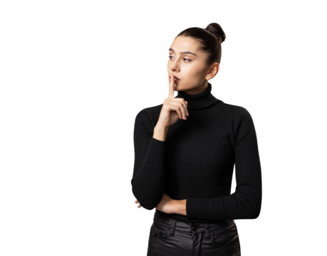 A young woman with a thoughtful expression, finger on lips, on a white background, portraying the concept of secrecy or contemplation