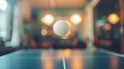 Ping pong ball mid-air above the table - obrazy, fototapety, plakaty