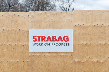 Naklejka premium plywood hoarding and sign of STRABAG, an international company specializing in tunnelling (Eglinton Crosstown Expansion, in Toronto, Canada)