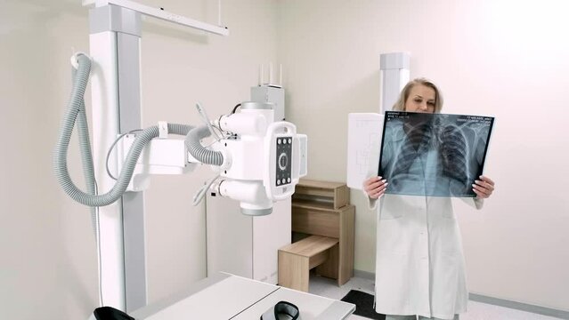 Consultation with a patient after an x-ray in a modern medical clinic. The specialist discusses the patient’s health status and takes care of his well-being.