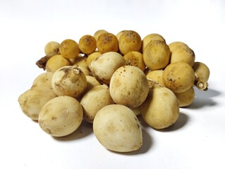 Sweet duku fruit. Duku fruit piled up on its branches with a white backgroyn 