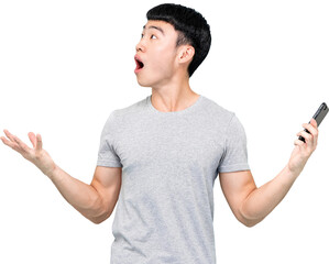 Astonished Asian man with mobile phone in hands looking up PNG file no background 