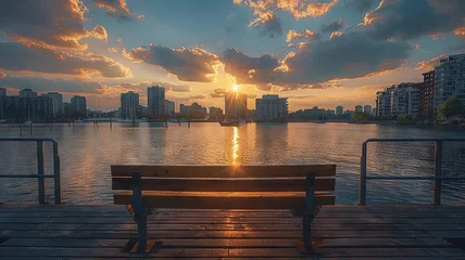  Sunlight bathes the cityscape viewed from a peaceful pier © Putra